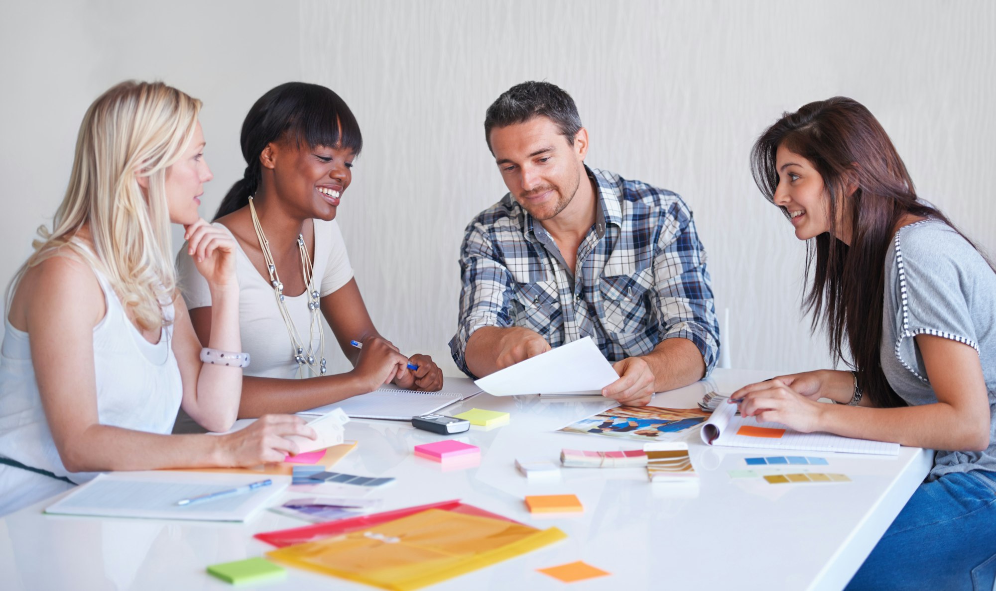 Brainstorming session at an agency. A creative team brainstorming in the boardroom together.