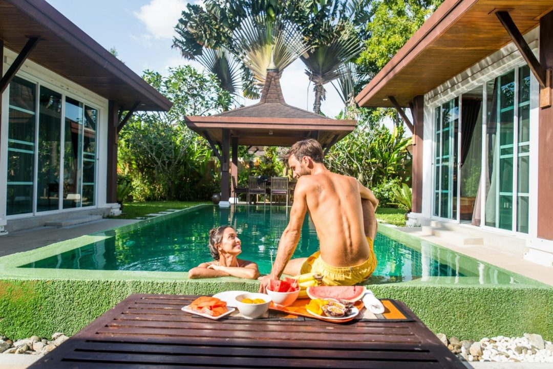 Couple of lovers in a beautiful villa with swimming pool