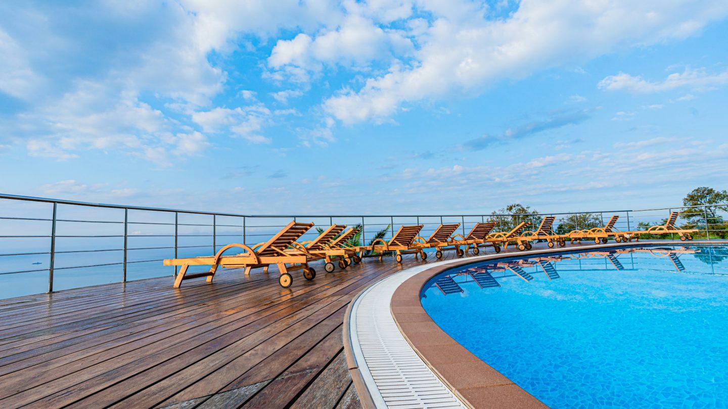 swimming pool near luxury villa. Sunny summer vacation