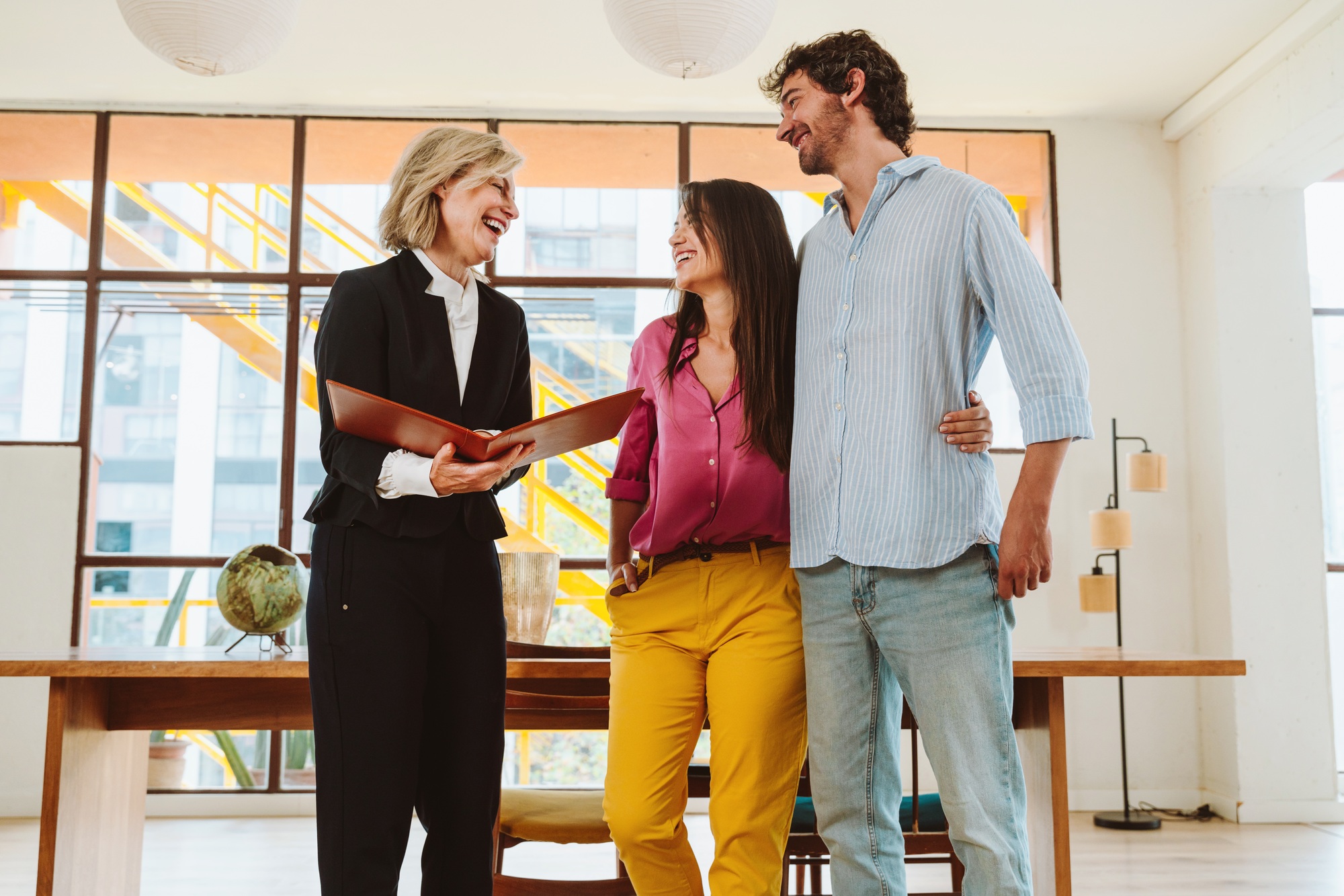 Real estate agent showing an apartment to a couple.