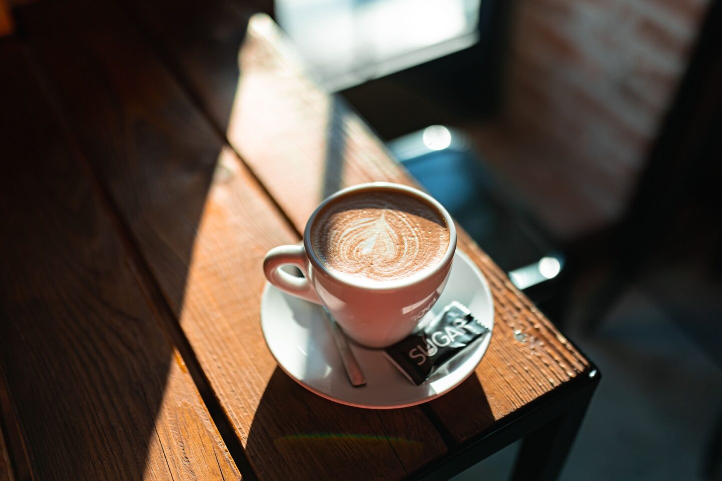 Coffee with Latte Art in Sunlight