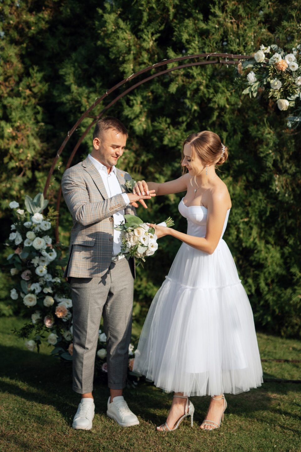 wedding ceremony of the newlyweds on the glade