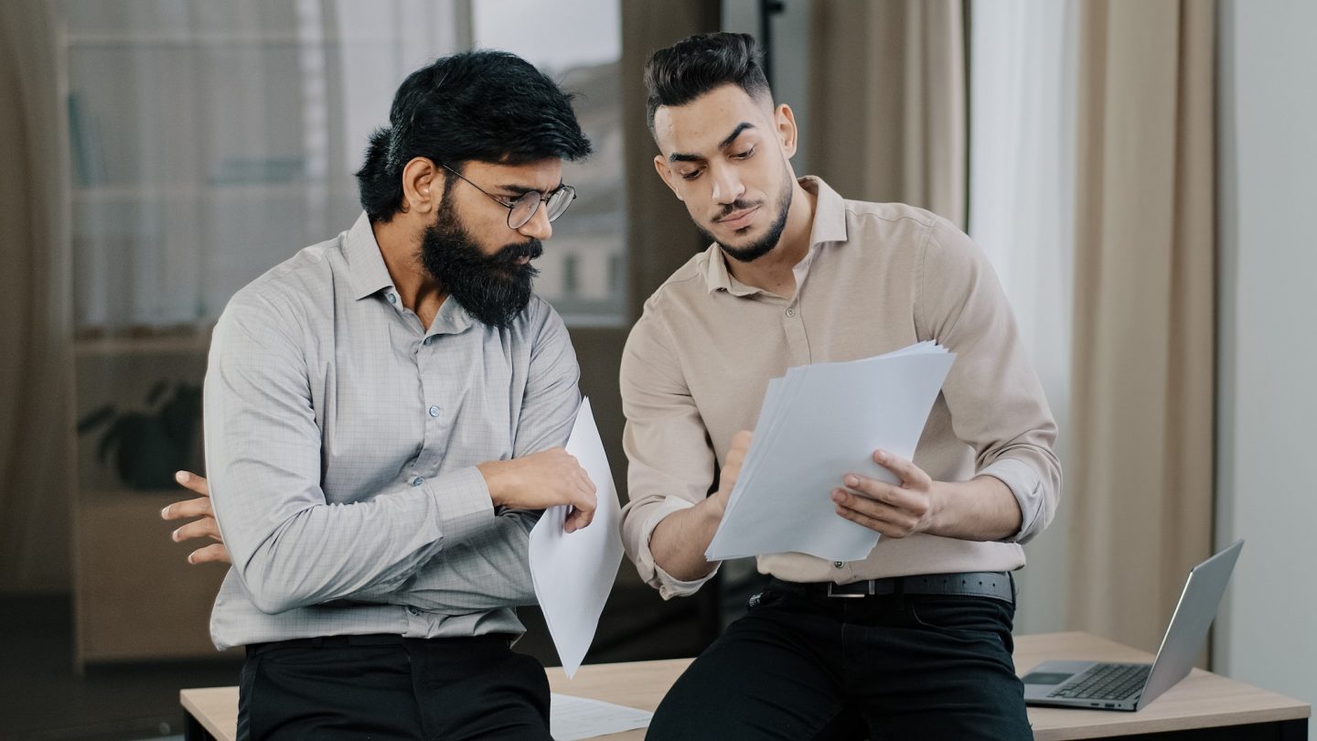 Multiracial business partners hispanic colleague consult male arabian co-worker team leader stand