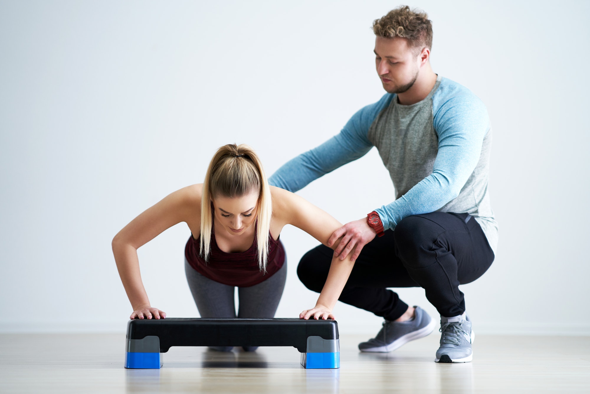 Woman with her personal fitness trainer