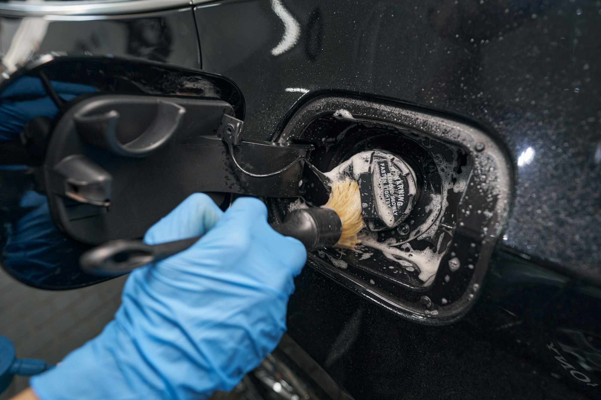 Car wash with water and foam cleaning
