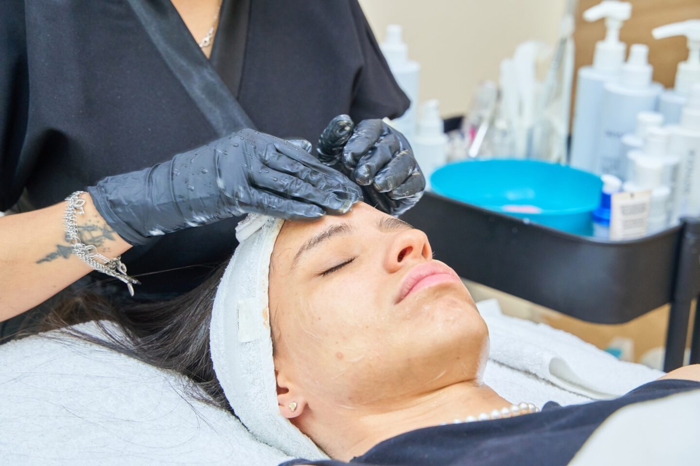 Acne Cleansing Woman with bad skin gets acne cleansing in clinic