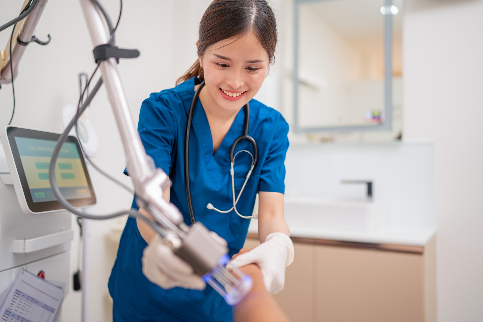 Portrait of asian young nurse with stethoscope beauty clinic.