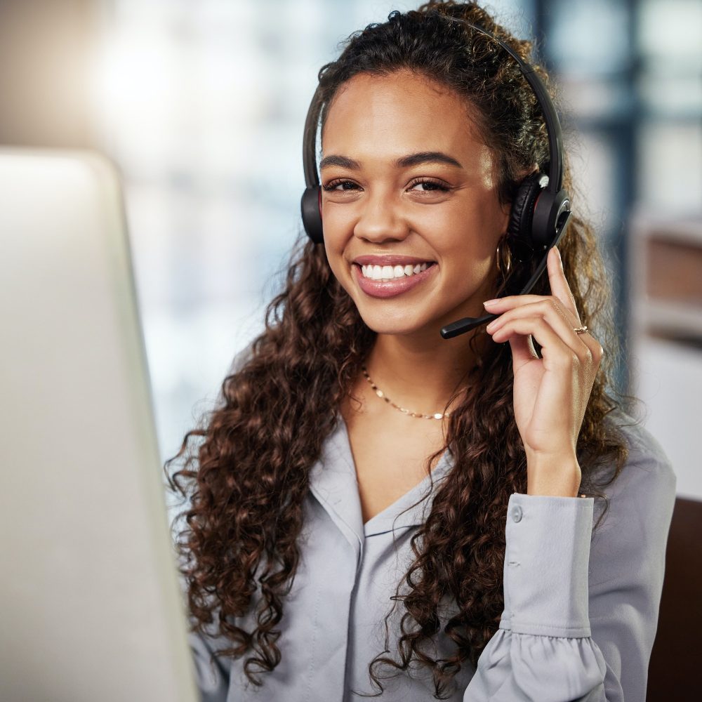 Ready to help and serve. Shot of a young businesswoman working in a call center.