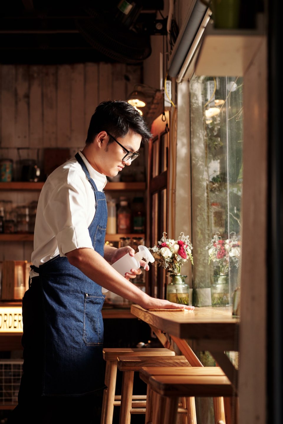 Coffeeshop Worker Wiping Surfaces
