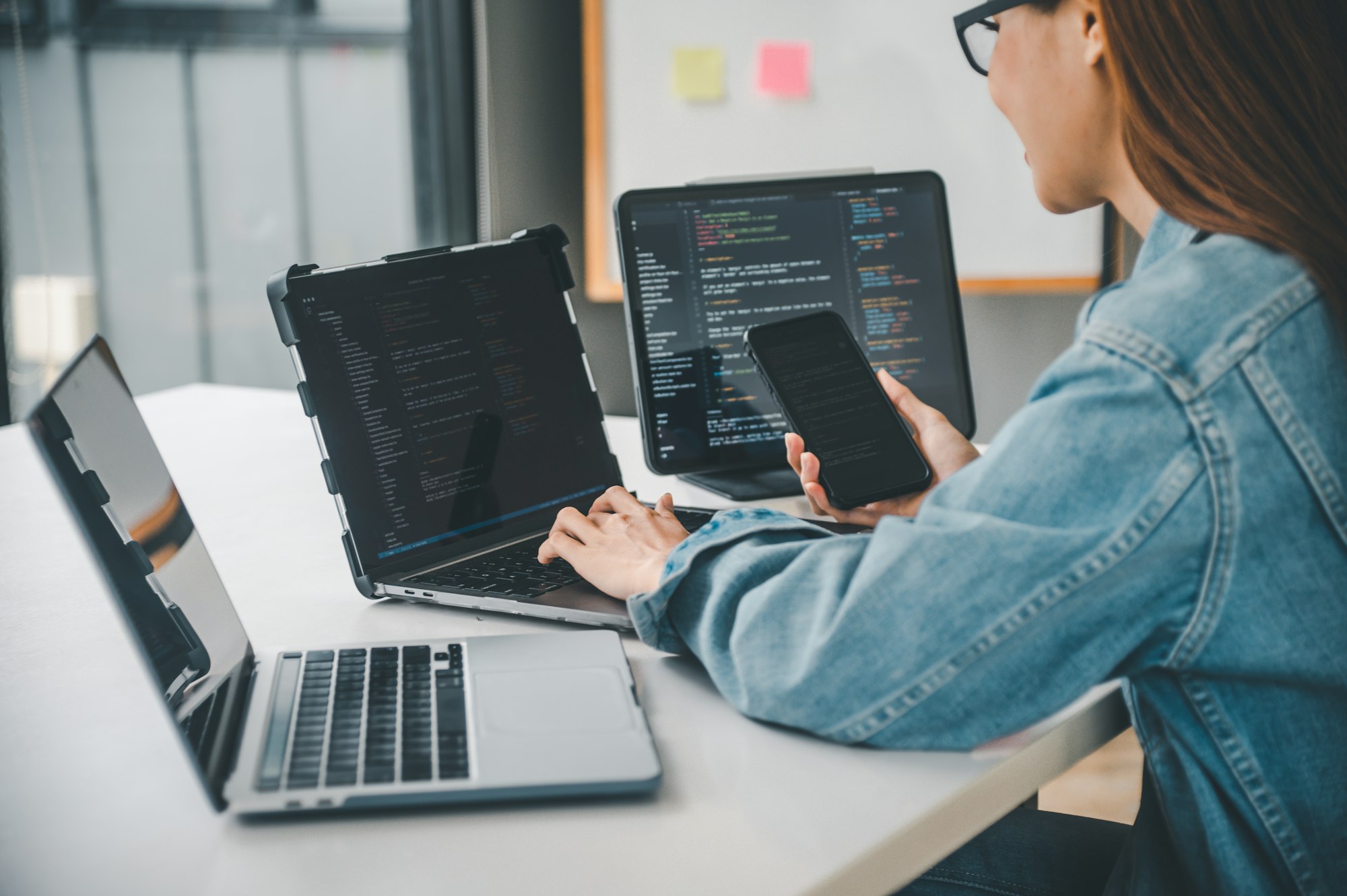 Female programmer working on coding, software development and web design.