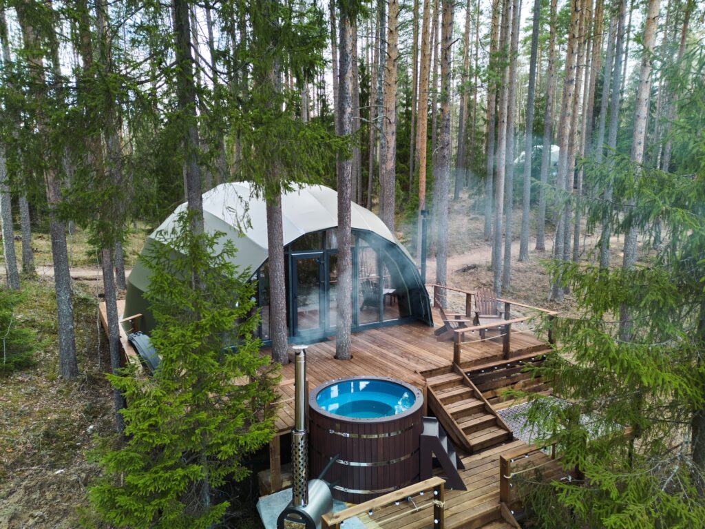 Discover a Serene Woodland Retreat featuring a luxurious Hot Tub nestled inside a Dome