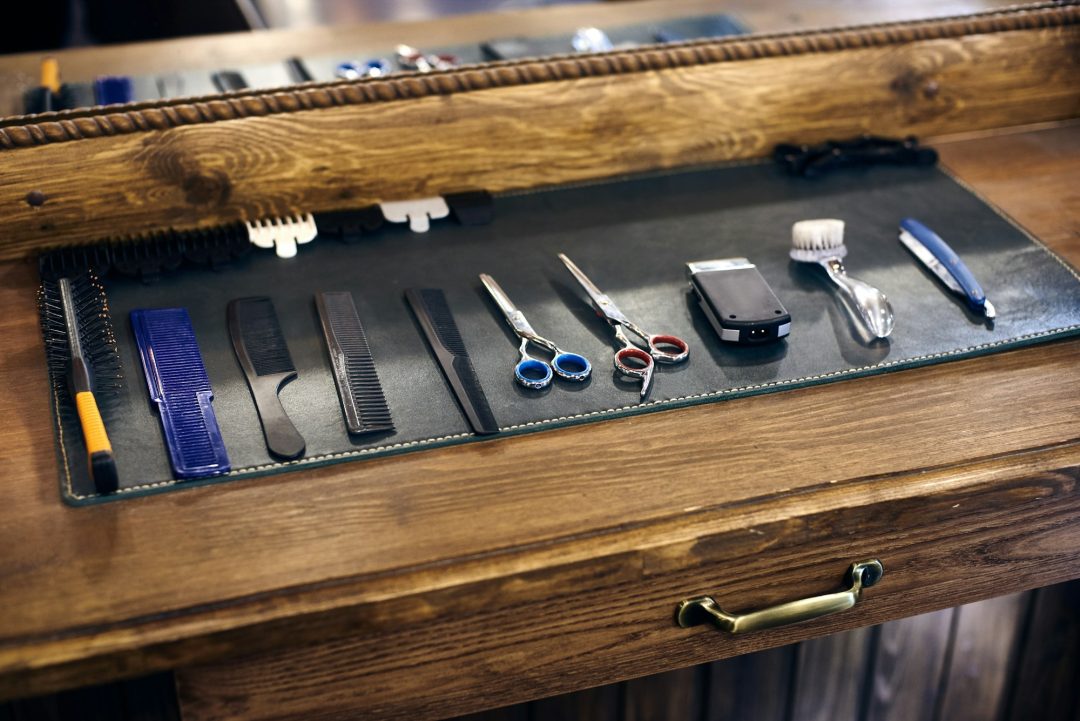 Set of barber shop tools and accessories for haircutting in professional hairdressing salon.