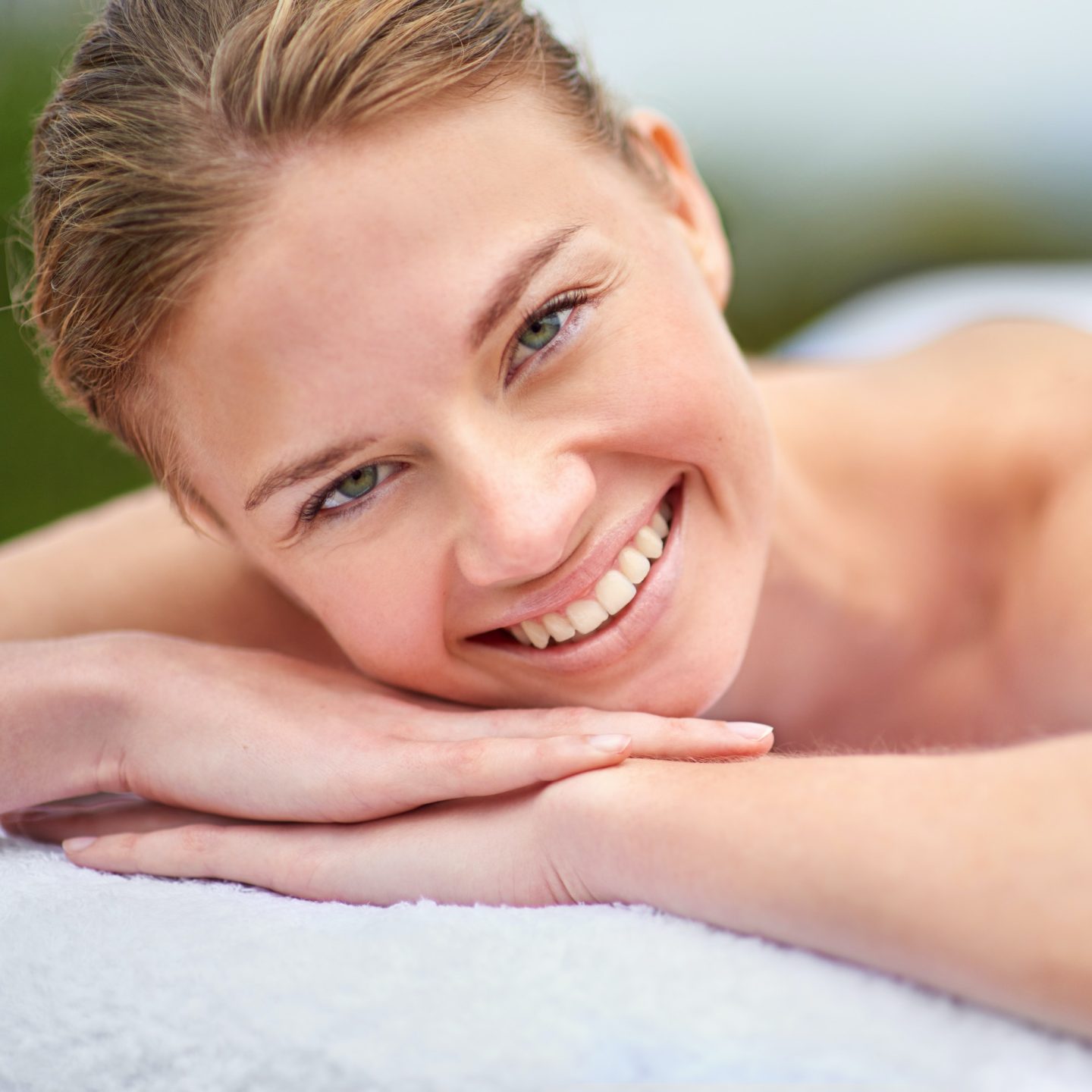 Im ready for my spa treatment. Cropped portrait of a young woman lying on a massage table.