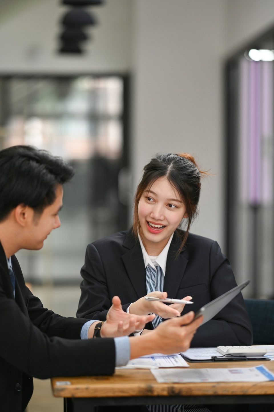 Beautiful young businesswoman sharing ideas business strategy, discussing information online.