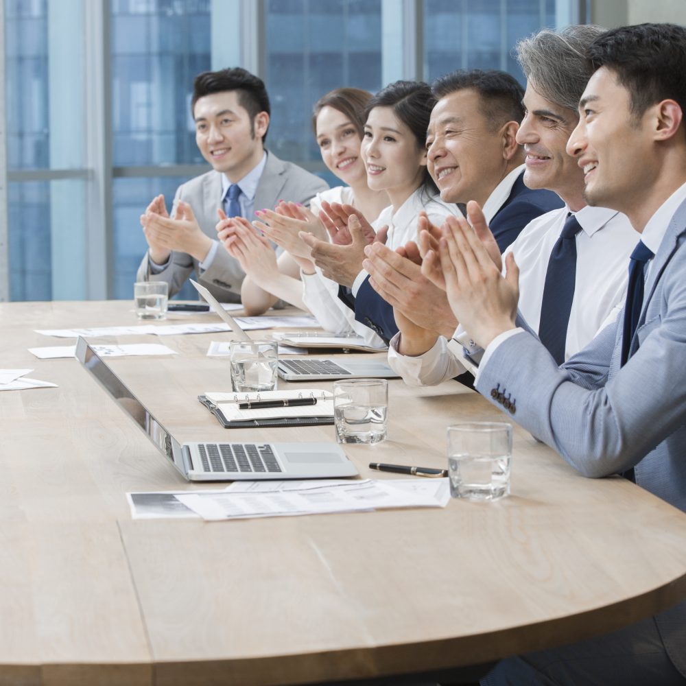 Business people having meeting in board room