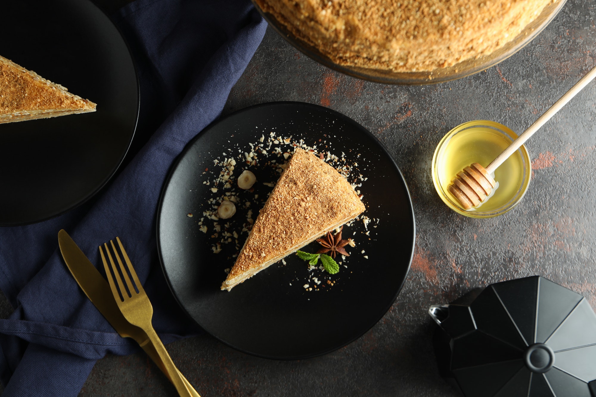 Concept of tasty dessert with honey cake, top view
