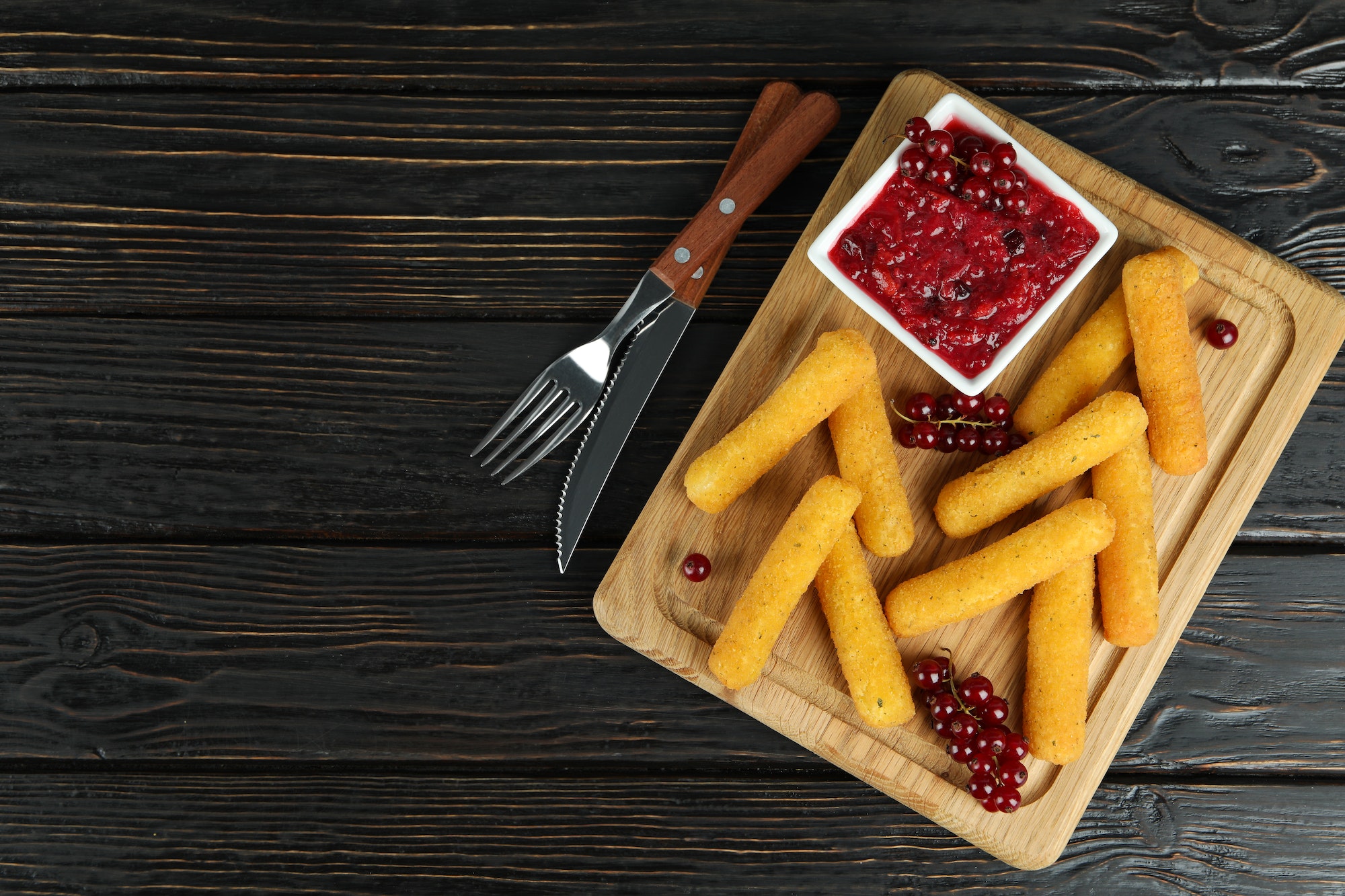 Concept of tasty food with cheese sticks on rustic wooden table