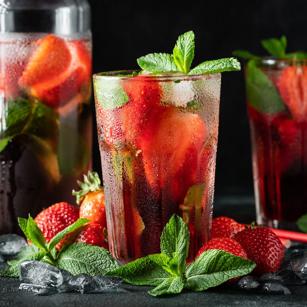 Fresh lemonade with ice, mint and strawberry.