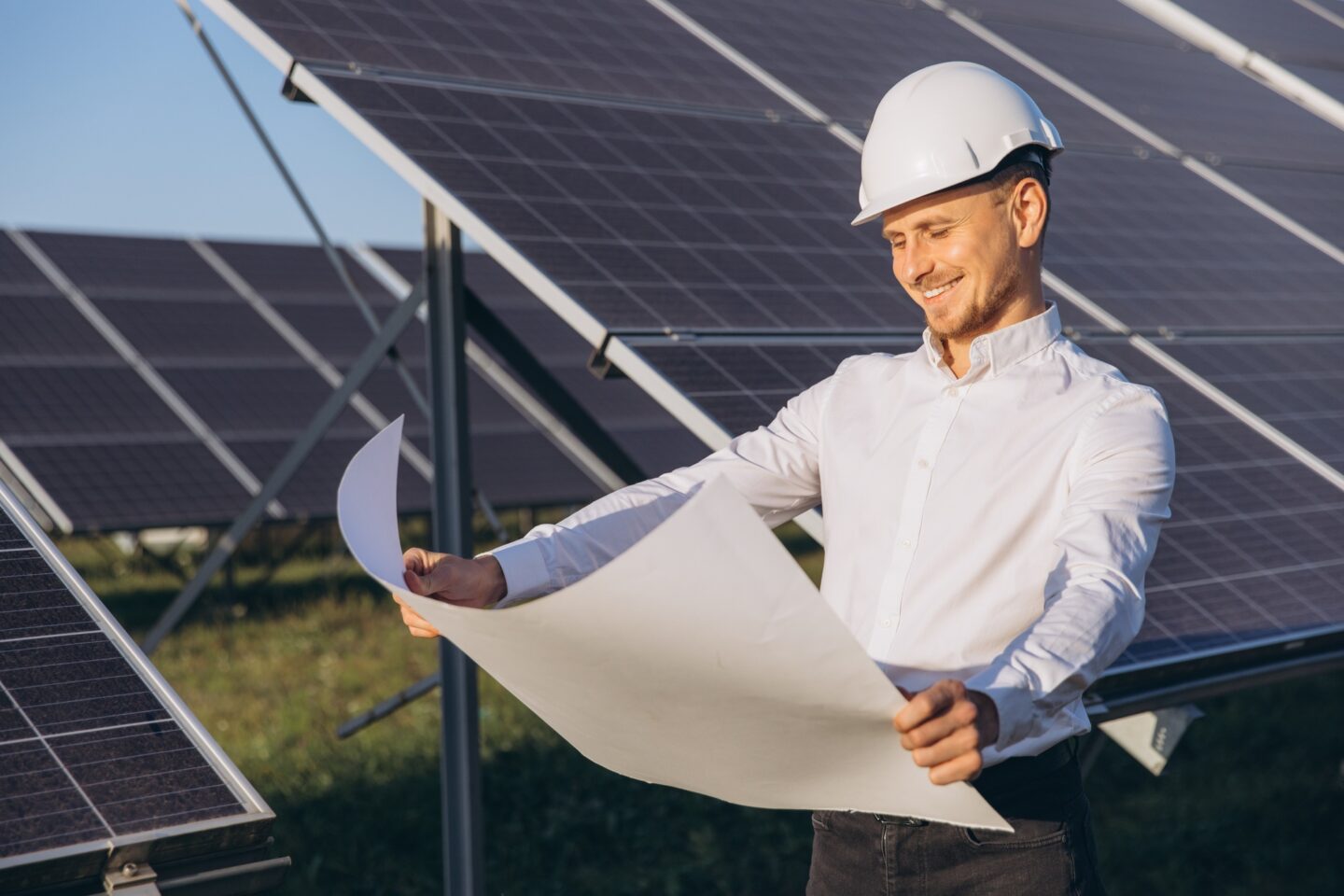 Engineer Inspecting Solar Panels for Renewable Energy Project