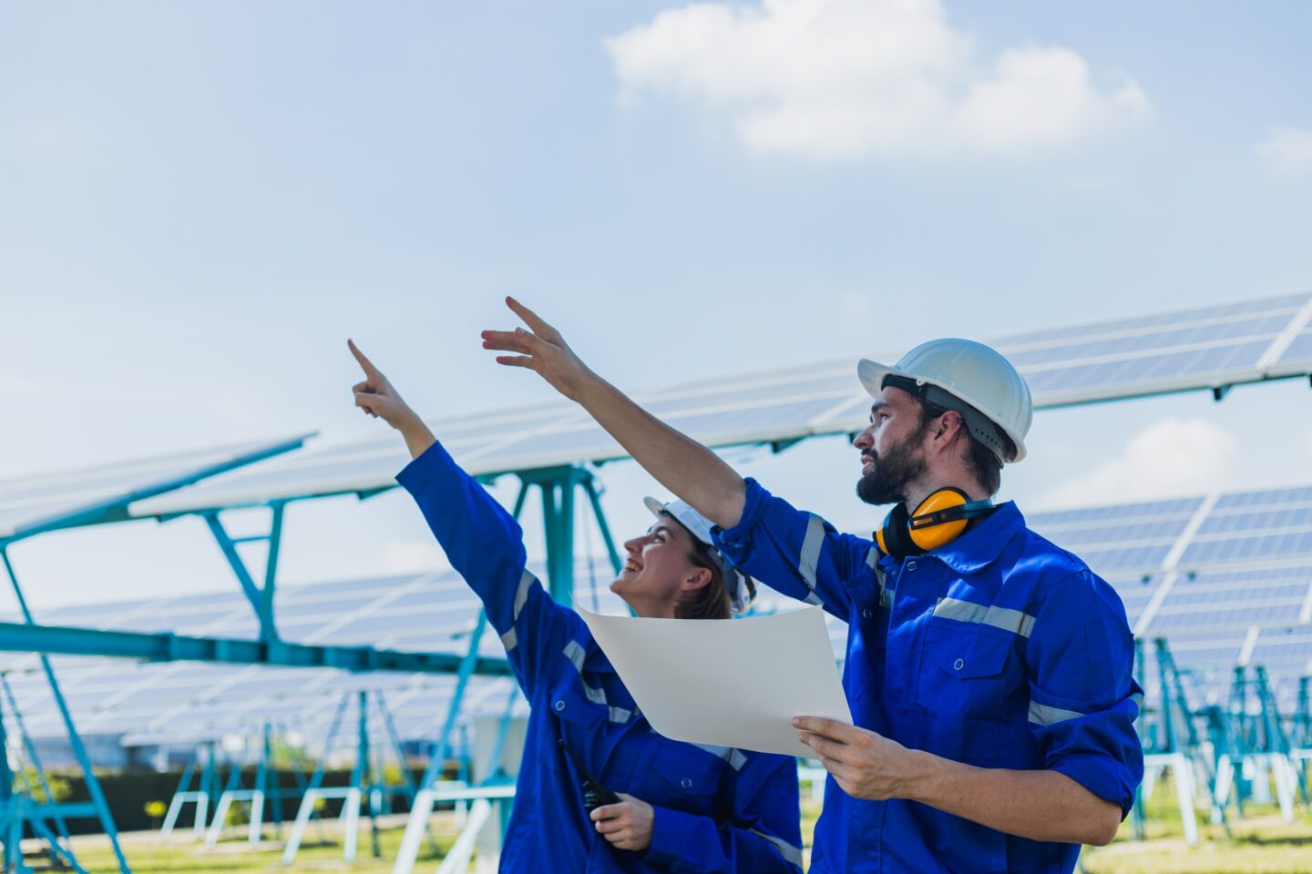 Engineers checking solar panel male and female at operation of solar panel system at solar station