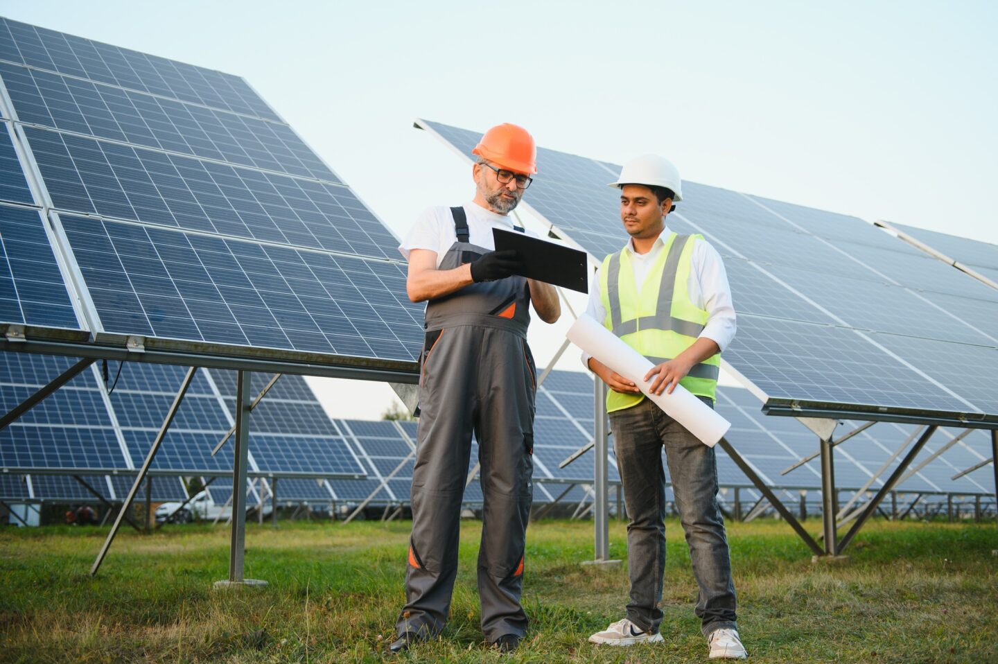 Two engineers Currently working on plans to install solar panels at renewable solar power plants.