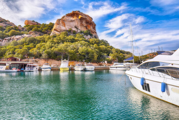 Enchanting view of Poltu Quatu port and bay with luxury yachts on Costa Smeralda.