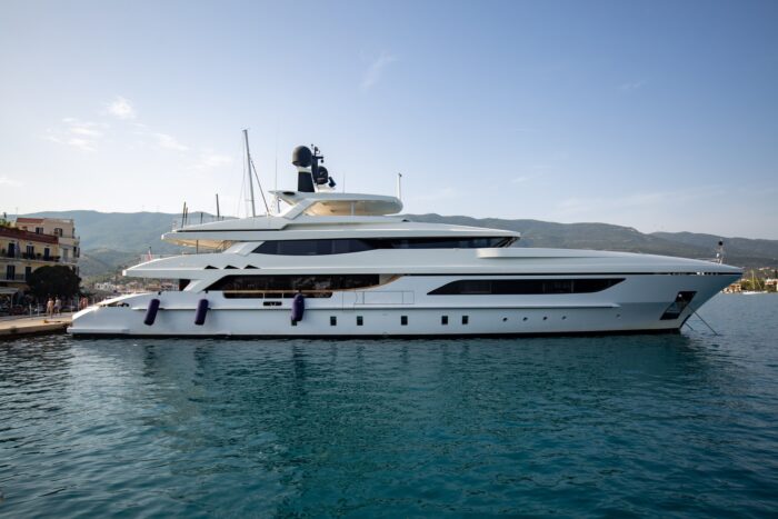 Luxurious yacht floating on deep sea waters on background of the blue